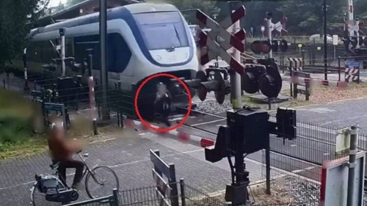 Vídeo impressionante mostra momento em que mulher quase é atropelada por trem